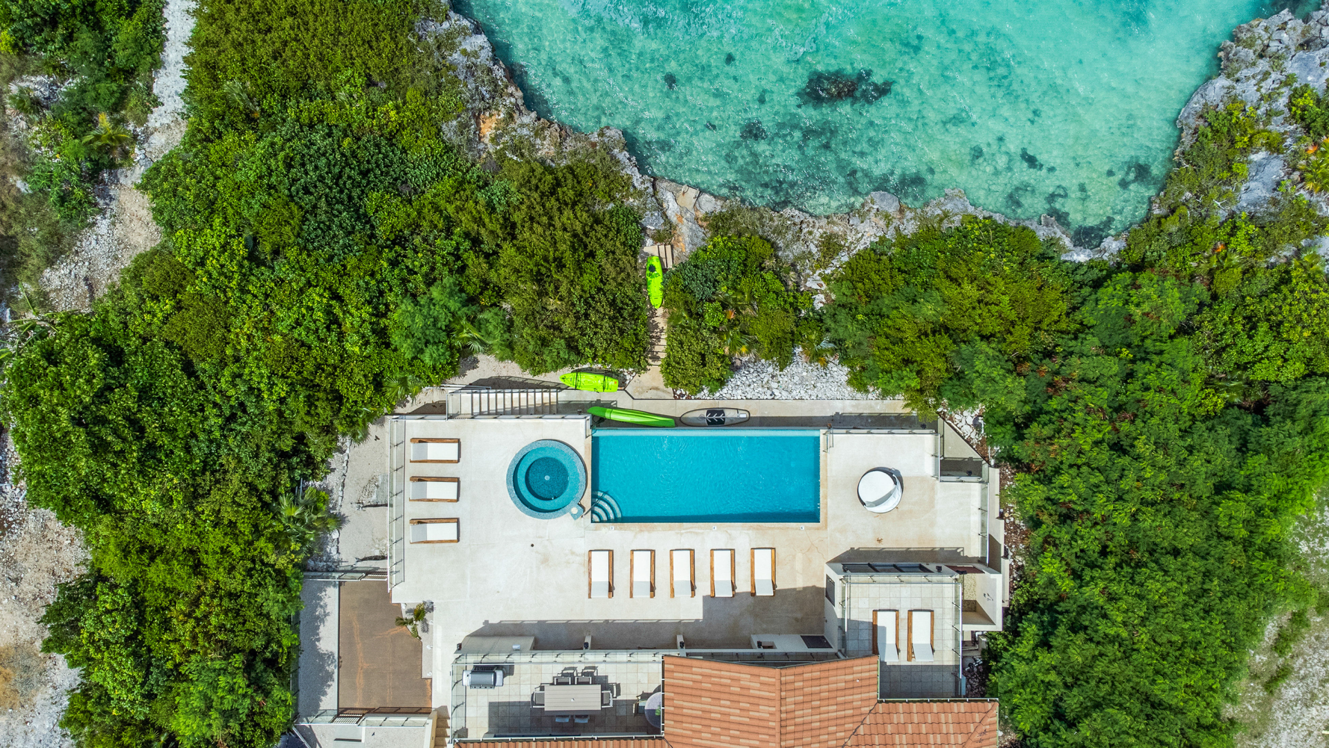 Drone overview of Alta Bella Villa's backyard